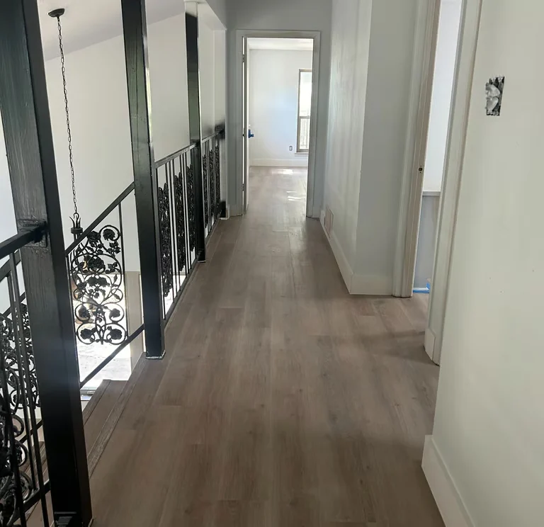 Upstairs hall with continuous wood-look flooring